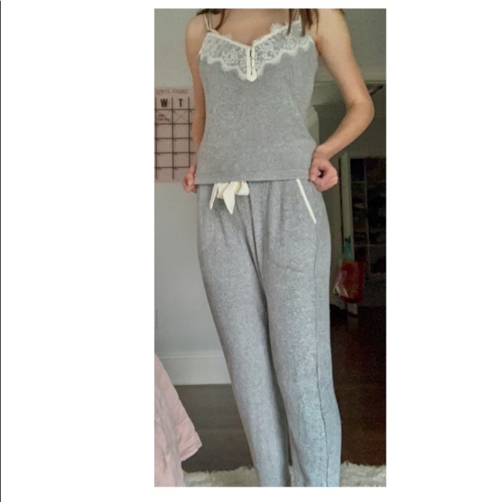 A grey and white pajama top <3